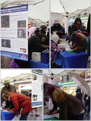 '二零一三年十一月二十三日,众多路人在雨中驻足签名制止中共活摘器官'